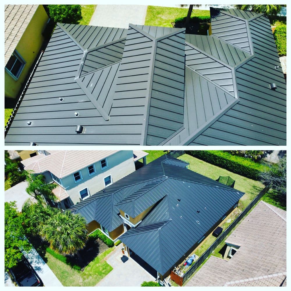 Aerial view of modern metal roofs featuring sleek black panels in a residential area.
